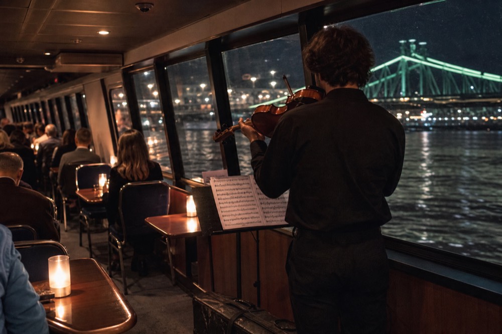 Danube dinner cruise with live music and city lights, no text, no logos, no people
