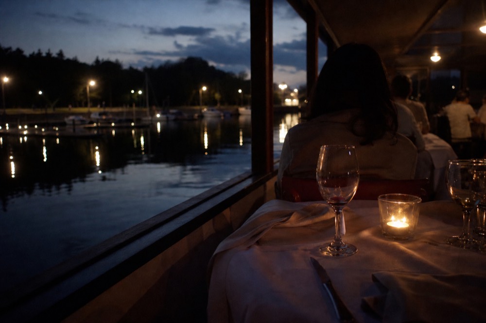 Candlelit dinner cruise table setting on the Danube, no text, no logos, no people