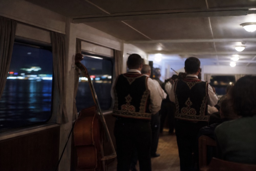 Hungarian folk musicians performing on a dinner cruise, no text, no logos, no people