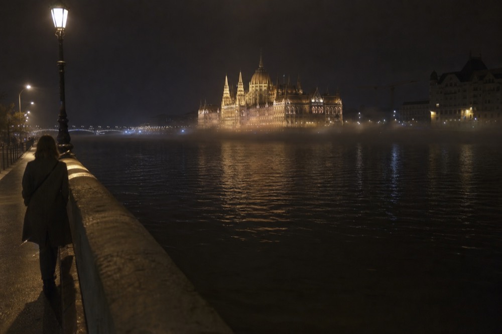 The illuminated Hungarian Parliament Building seen from the Danube at night, no text, no logos, no people