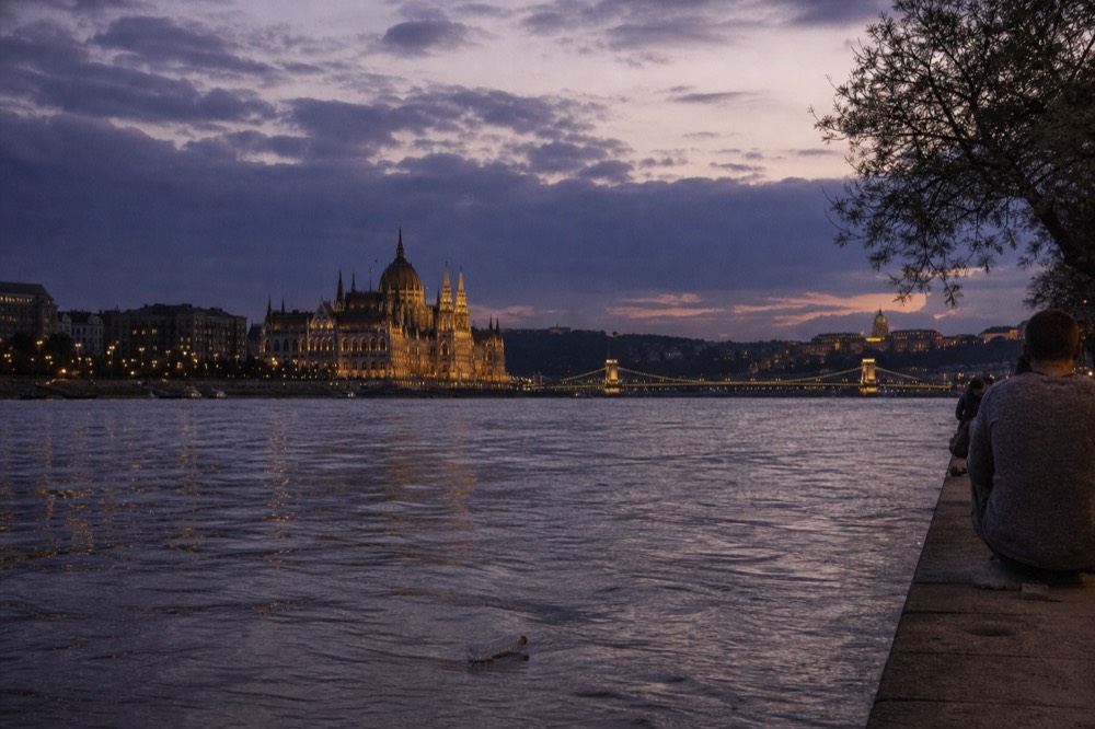 Budapest skyline from the river showing the Parliament building and Chain Bridge at dusk, no text, no logos, no people