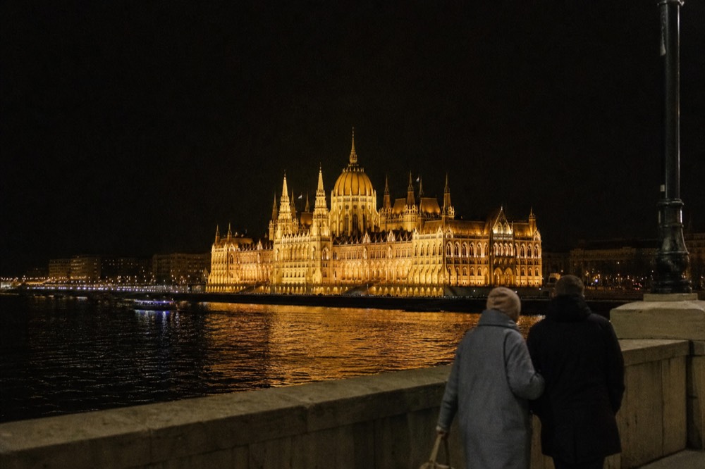 The illuminated Hungarian Parliament building seen from the Danube at night, no text, no logos, no people