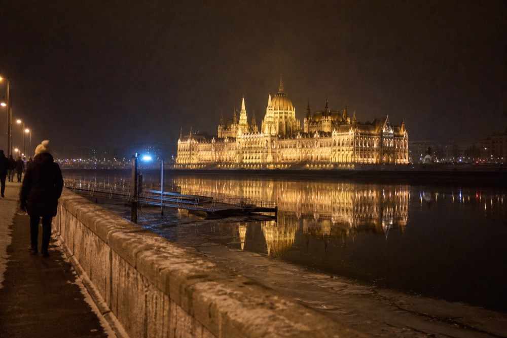 The illuminated Hungarian Parliament Building reflected in the Danube at night, no text, no logos, no people.