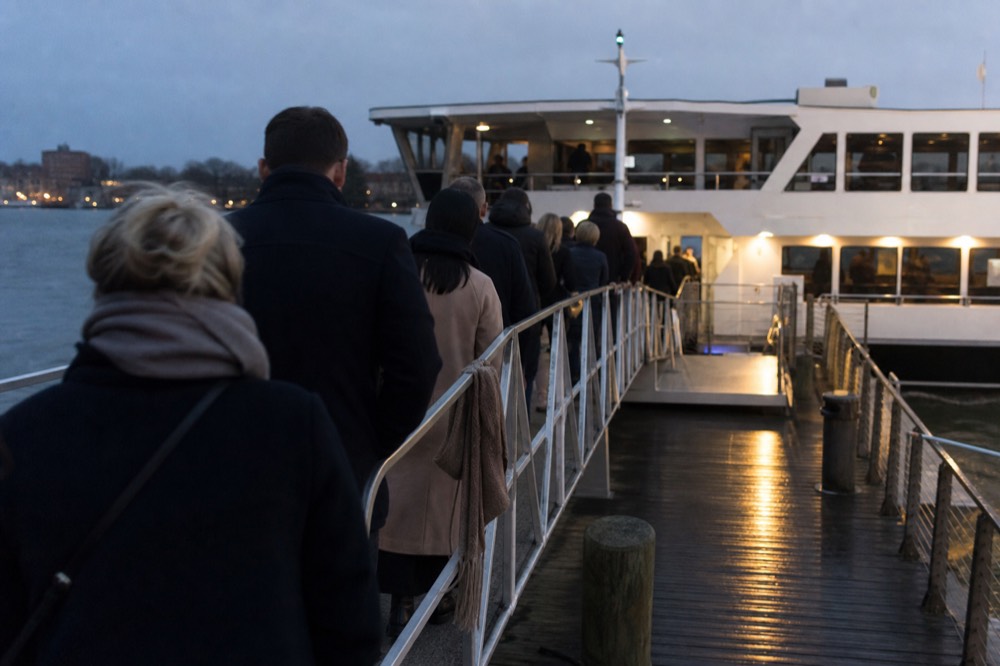 Passengers boarding a night cruise boat at a dock on the Danube, no text, no logos, no people