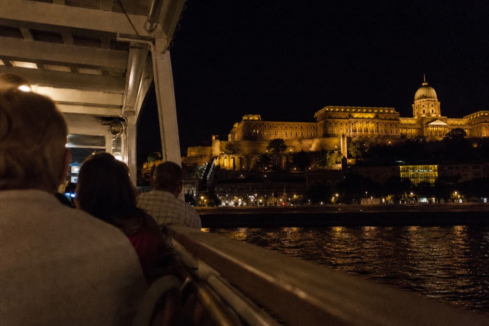 Buda Castle and the Danube at night seen from the river, no text, no logos, no people