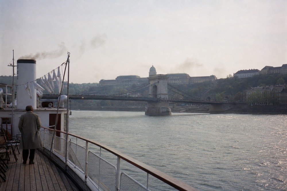 A historic ship cruising past the Chain Bridge and Buda Castle on the Danube, no text, no logos, no people